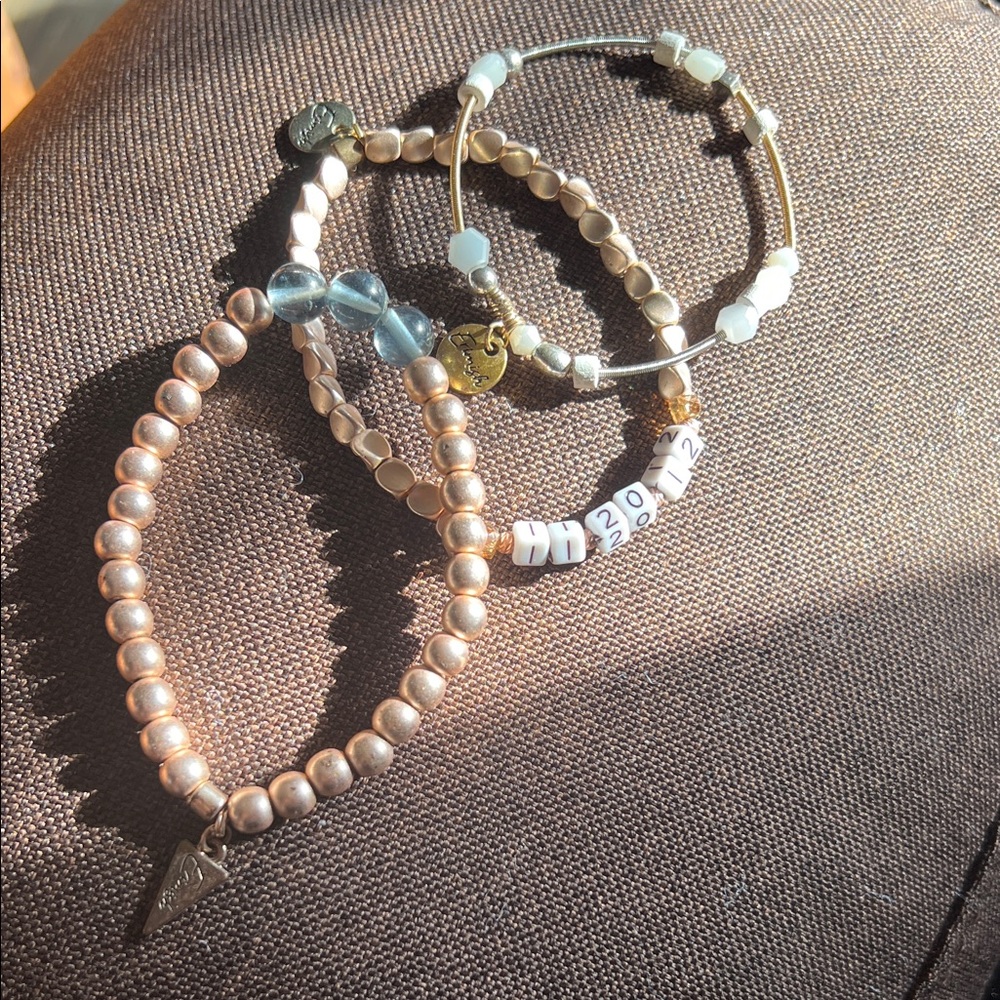3 Erimish bracelets. One is marked with the date Erimish was created